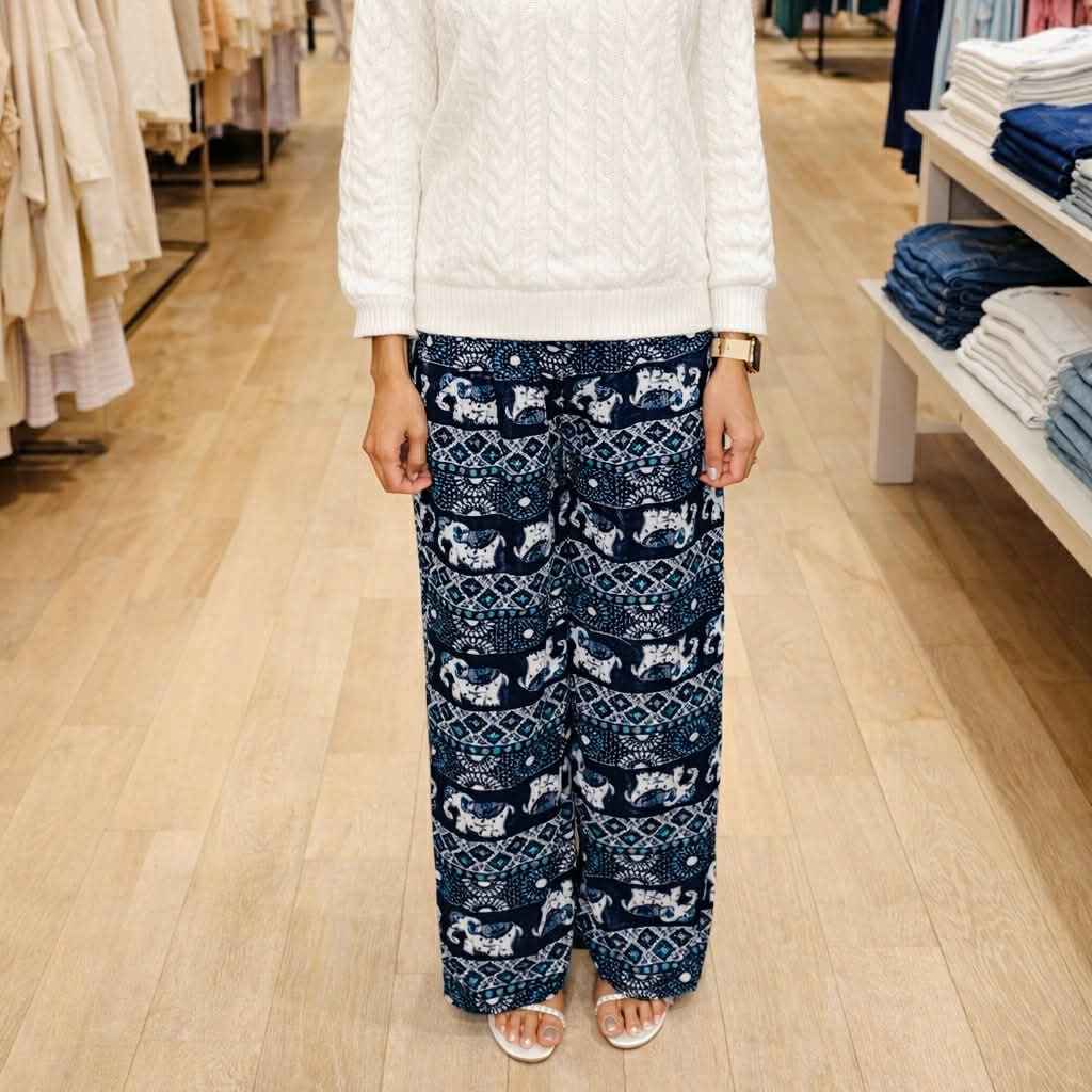 Person wearing navy patterned pants in a store setting