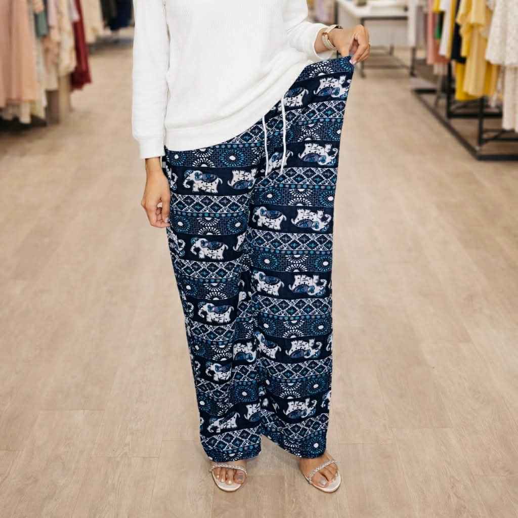 Person wearing navy patterned pants in a store setting