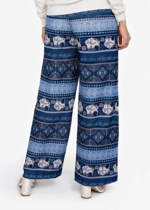Blue patterned pants with white elephants on a white background