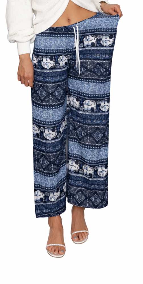 Blue patterned pants worn by a person on a white background