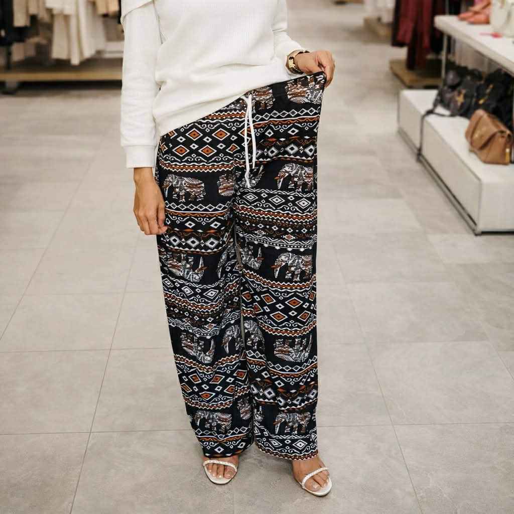 Person wearing patterned pants in a store setting