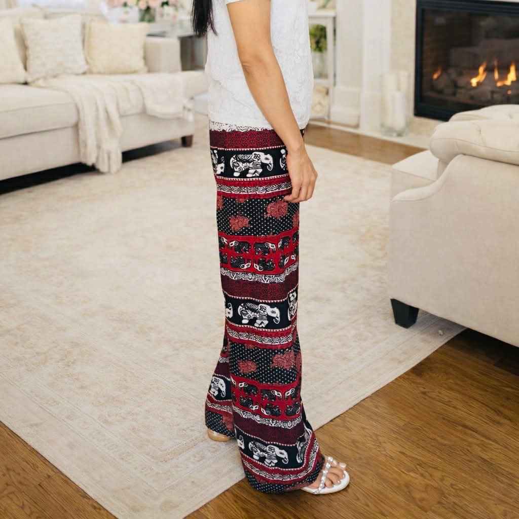 Person wearing patterned pants in a living room setting