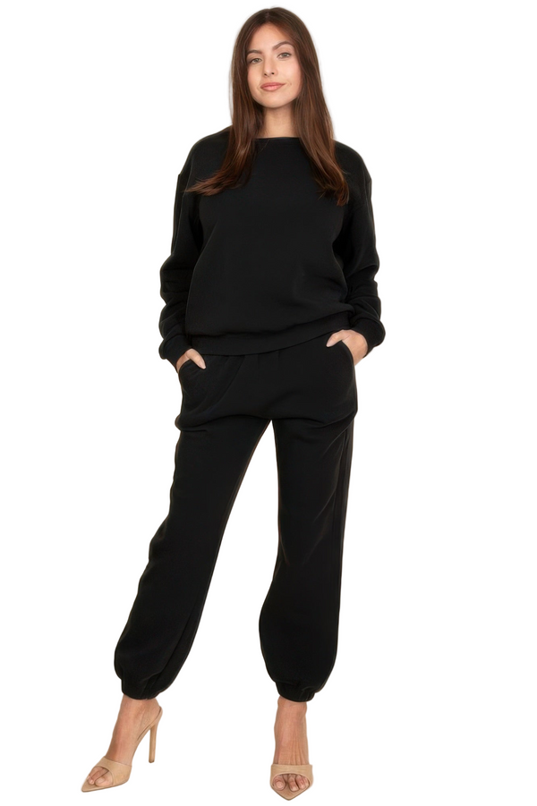 Woman wearing a black outfit on a white background