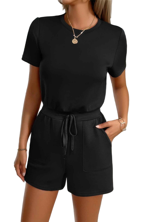 Black romper worn by a person on a white background