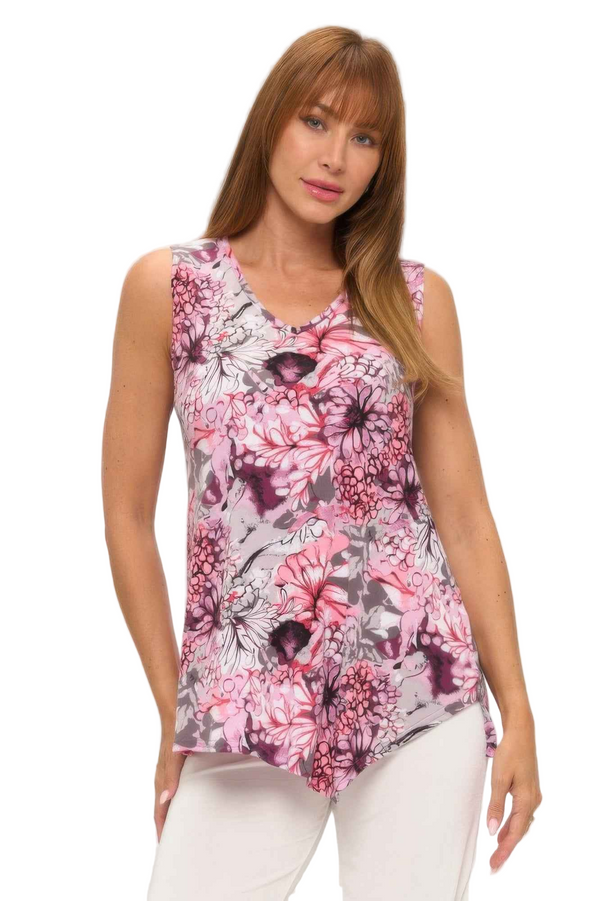 Woman wearing a sleeveless floral top on a white background