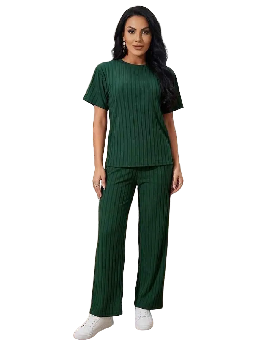 Woman wearing a green ribbed outfit on a white background